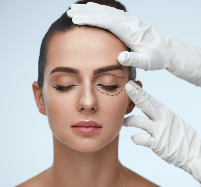 stock image of model with sketch marks around her eyes