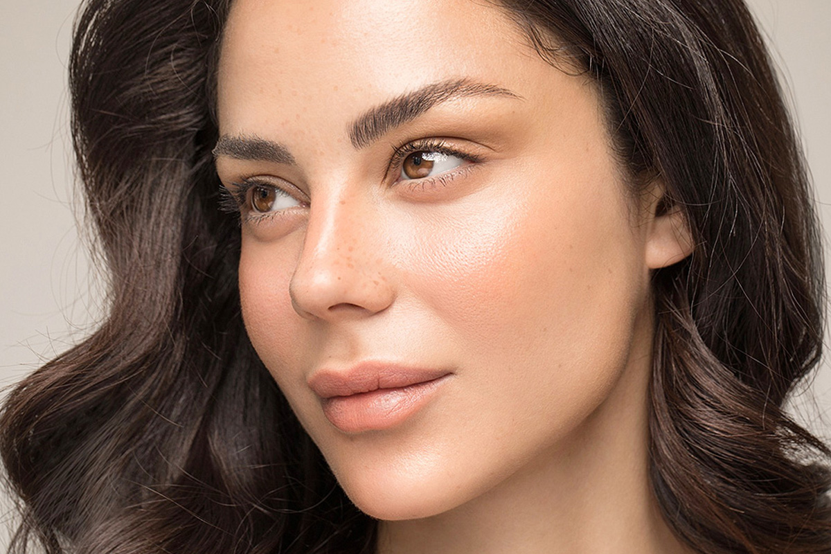 beautiful natural blonde woman with freckles skin